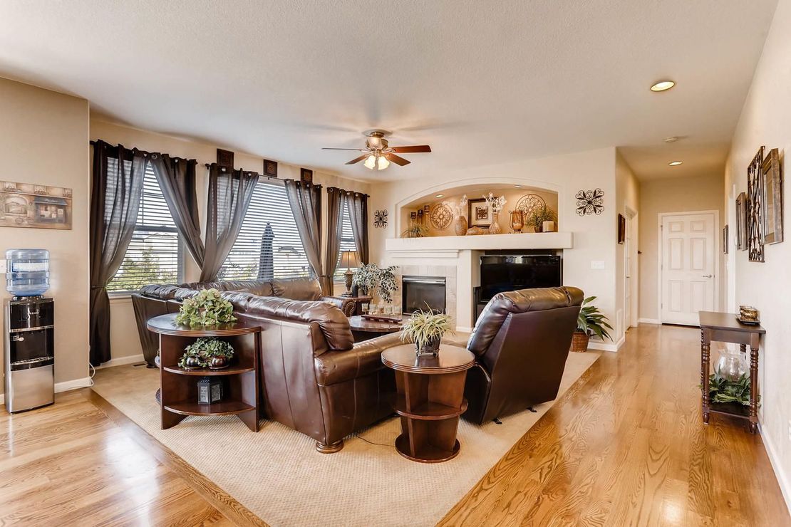 A living room filled with furniture and a fireplace.