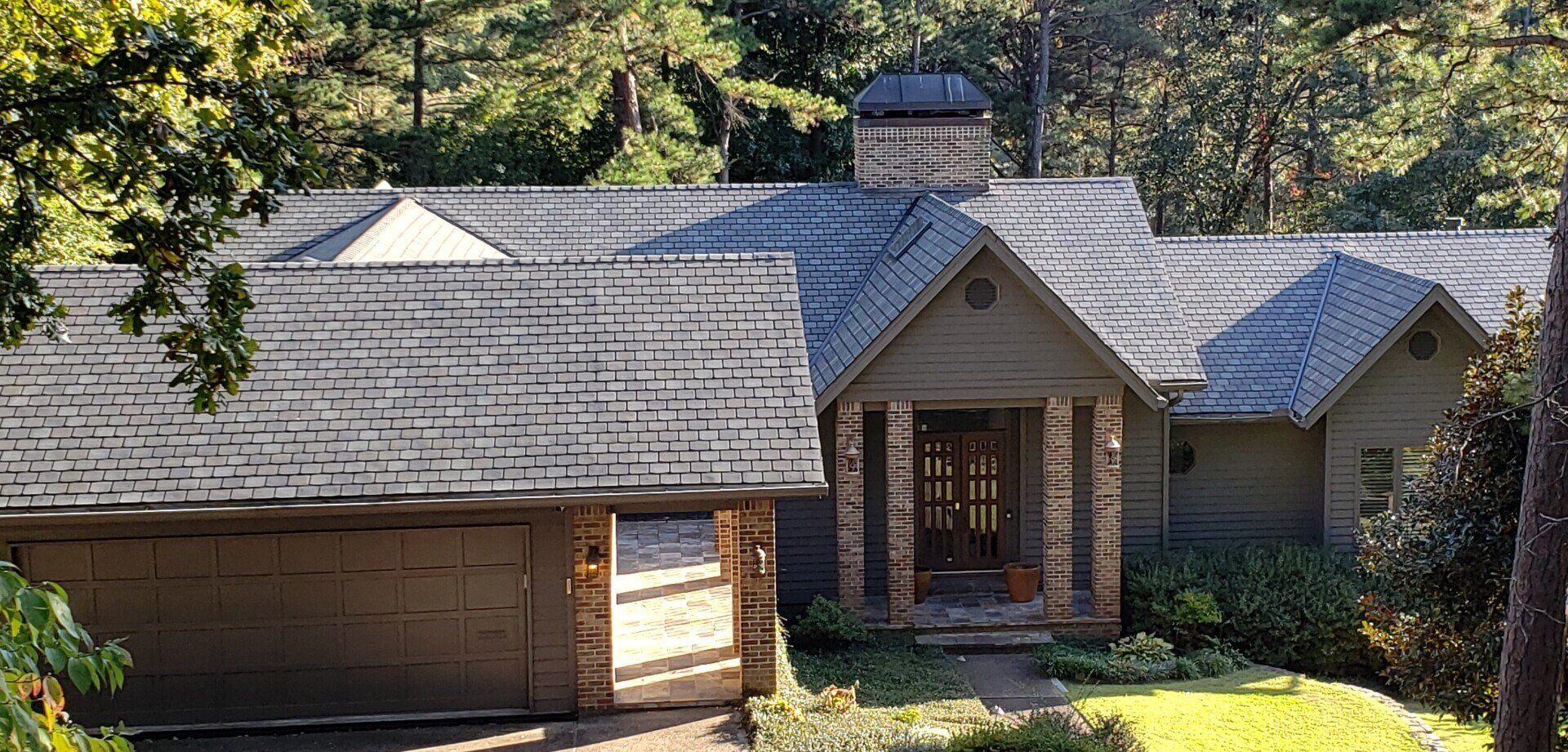 A house with a roof that has shingles on it