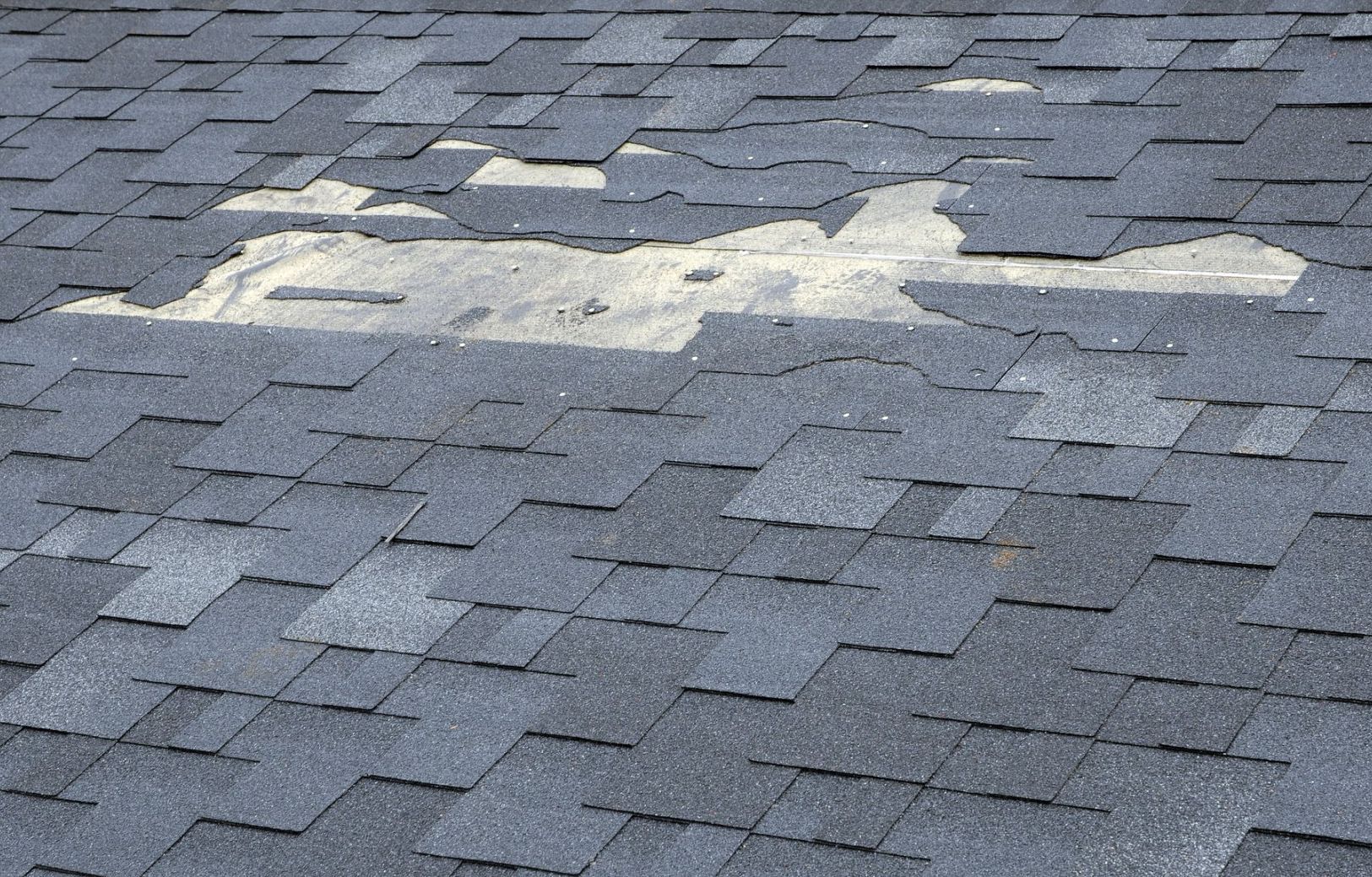 A close up of a roof with a hole in it.