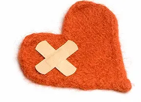 heart with a first aid patch