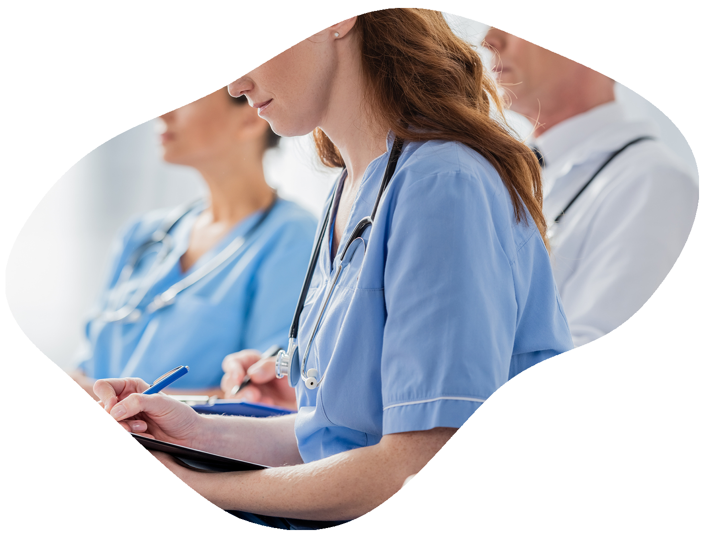A group of doctors and nurses are sitting in a row.