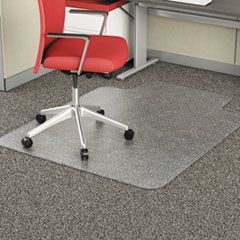 A red office chair is sitting under a desk with a mat on the floor.