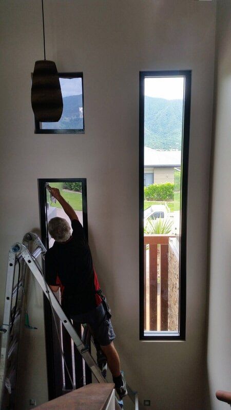 Man installing window tint — Safety and Security Films in Trinity Beach, QLD