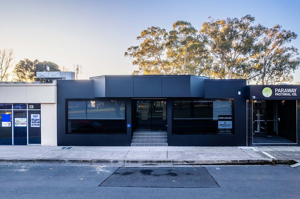 A Building With A Sign — Construction & Renovation Services in Dubbo, NSW