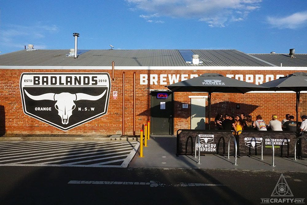 A Brick Building with A Sign that Says Badlands Brewery — Construction & Renovation Services in Dubbo, NSW