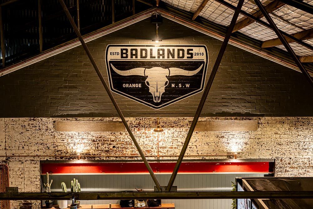 A Sign On The Ceiling Of A Building With A Bull Skull On It — Construction & Renovation Services in Dubbo, NSW