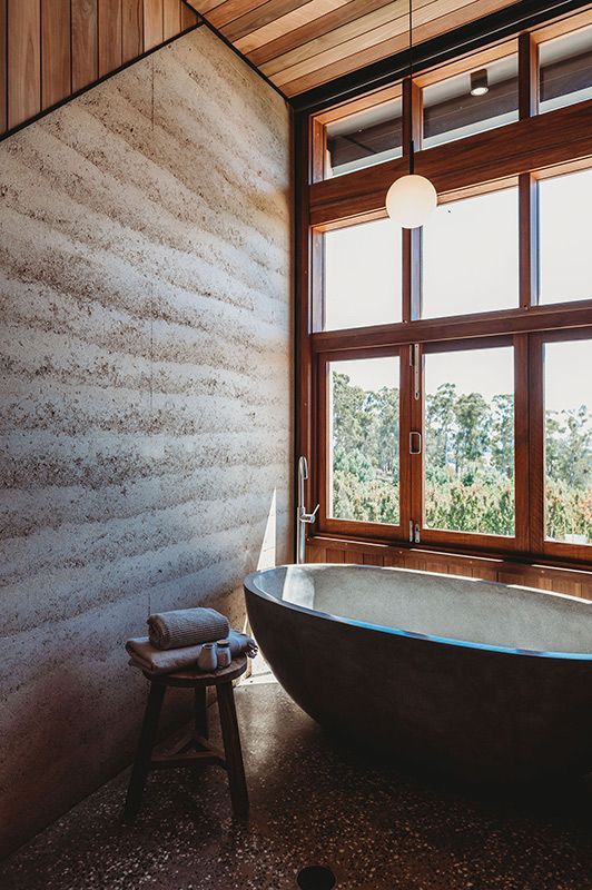 A Bathroom with A Large Tub and Lots of Windows — Construction & Renovation Services in Dubbo, NSW