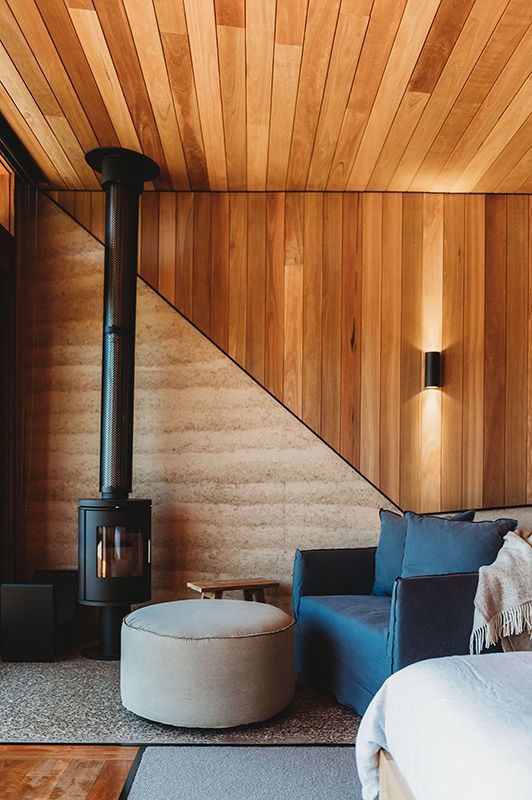 A Living Room with Wood Paneling and A Fireplace — Construction & Renovation Services in Dubbo, NSW