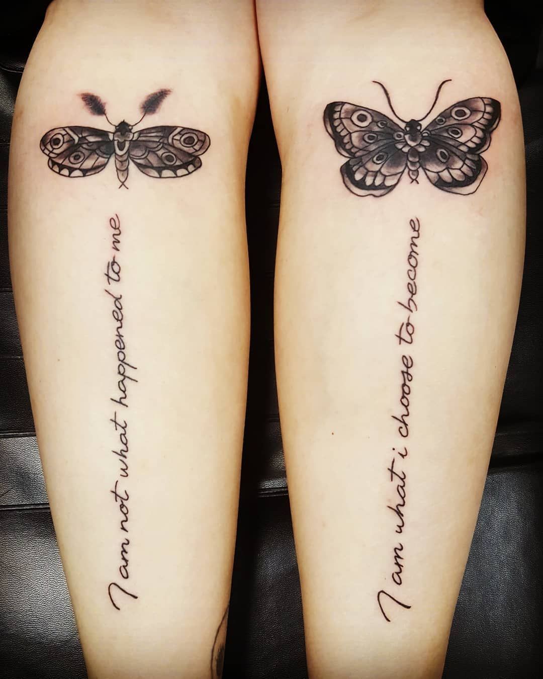 Two leg tattoos: moth and butterfly above text,