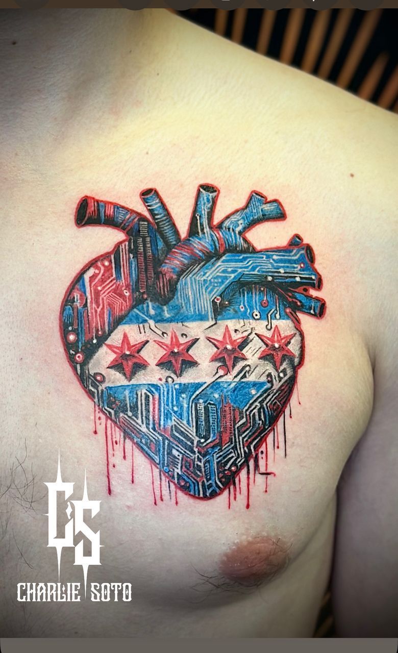 Tattoo on chest: a heart merging with the Chicago flag, circuit board design. Red, blue, and white colors.