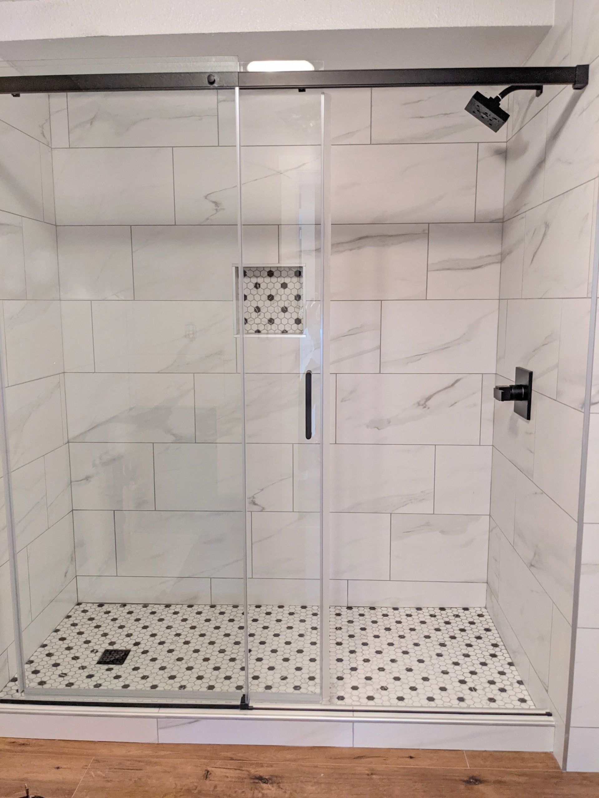 modern bathrrom with bath cabin of glass