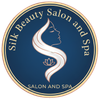 Silk Beauty Salon and Spa logo. Blue circle with text and a woman's profile intertwined with a white S shape, a small lotus flower.