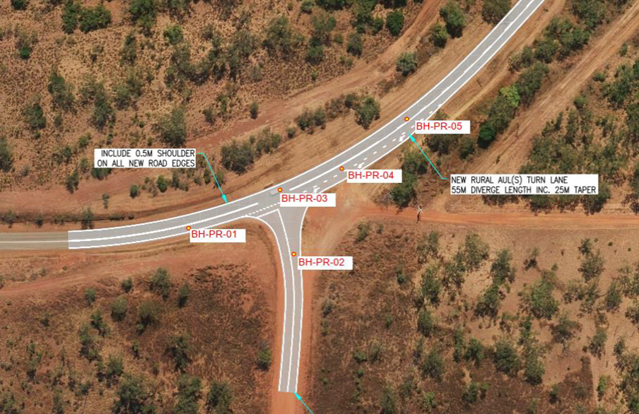 An aerial view of a road intersection in the desert