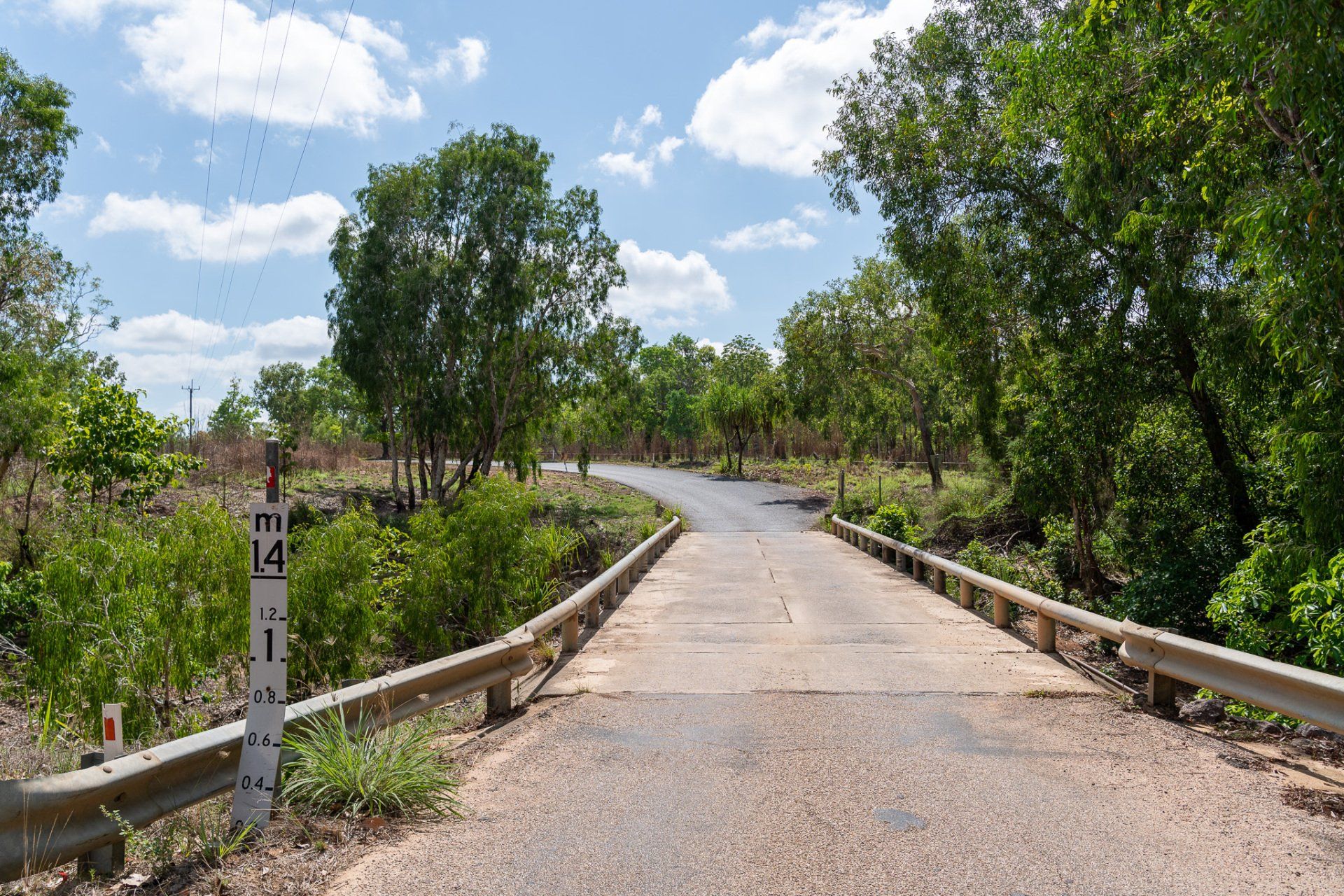 A road with trees and a sign that says 4 on it