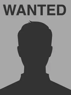 A wanted poster with a silhouette of a man 's head.