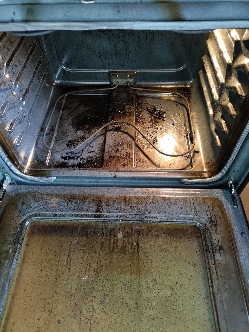 The inside of an oven is very dirty and needs to be cleaned.