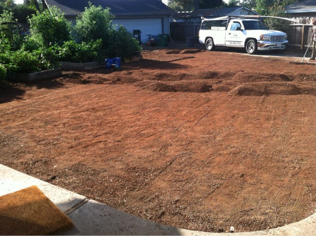 A White Truck Is Parked in The Dirt in Front of A House - Oroville, CA - JR Landscaping 