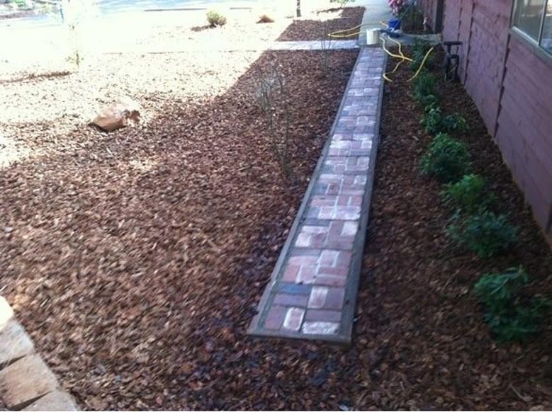 A Brick Walkway in The Backyard of A House - Oroville, CA - JR Landscaping 