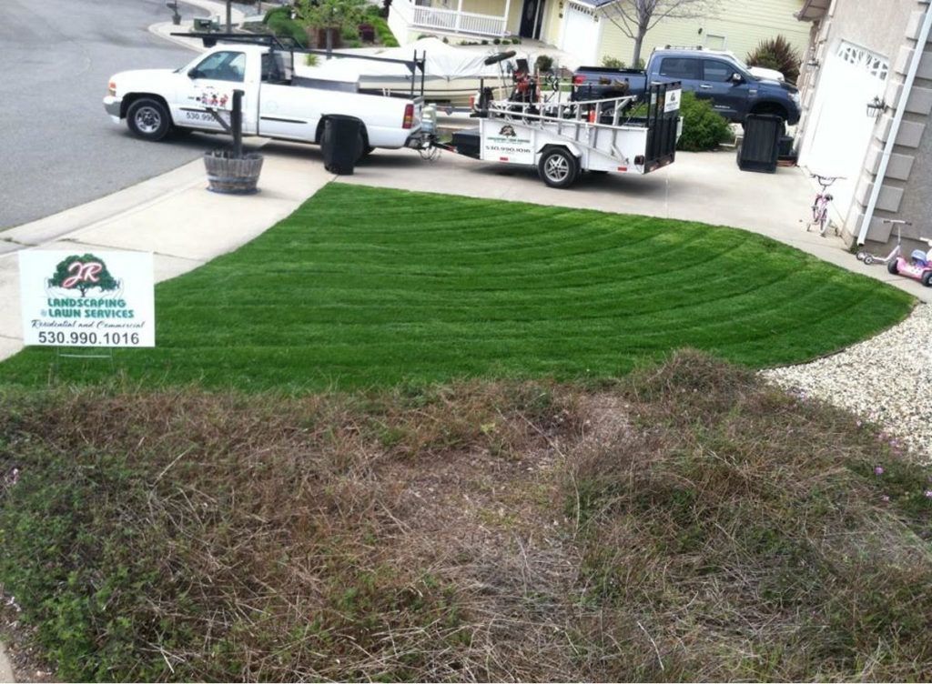 A White Truck Is Parked in Front of A Lush Green Lawn - Oroville, CA - JR Landscaping