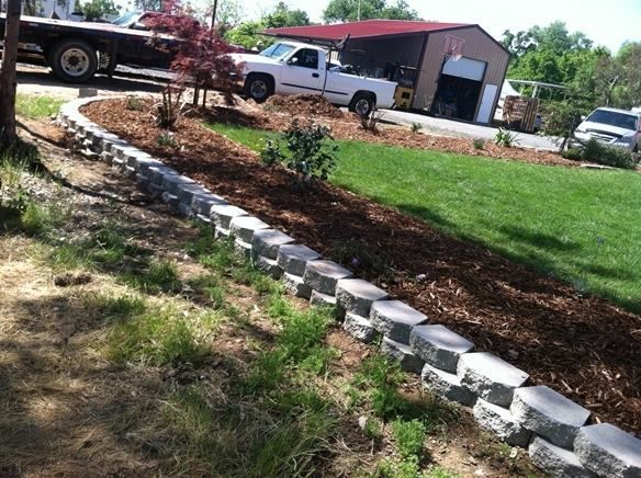 A White Truck Is Parked on The Side of The Road in Front of A Garage - Oroville, CA - JR Landscaping 