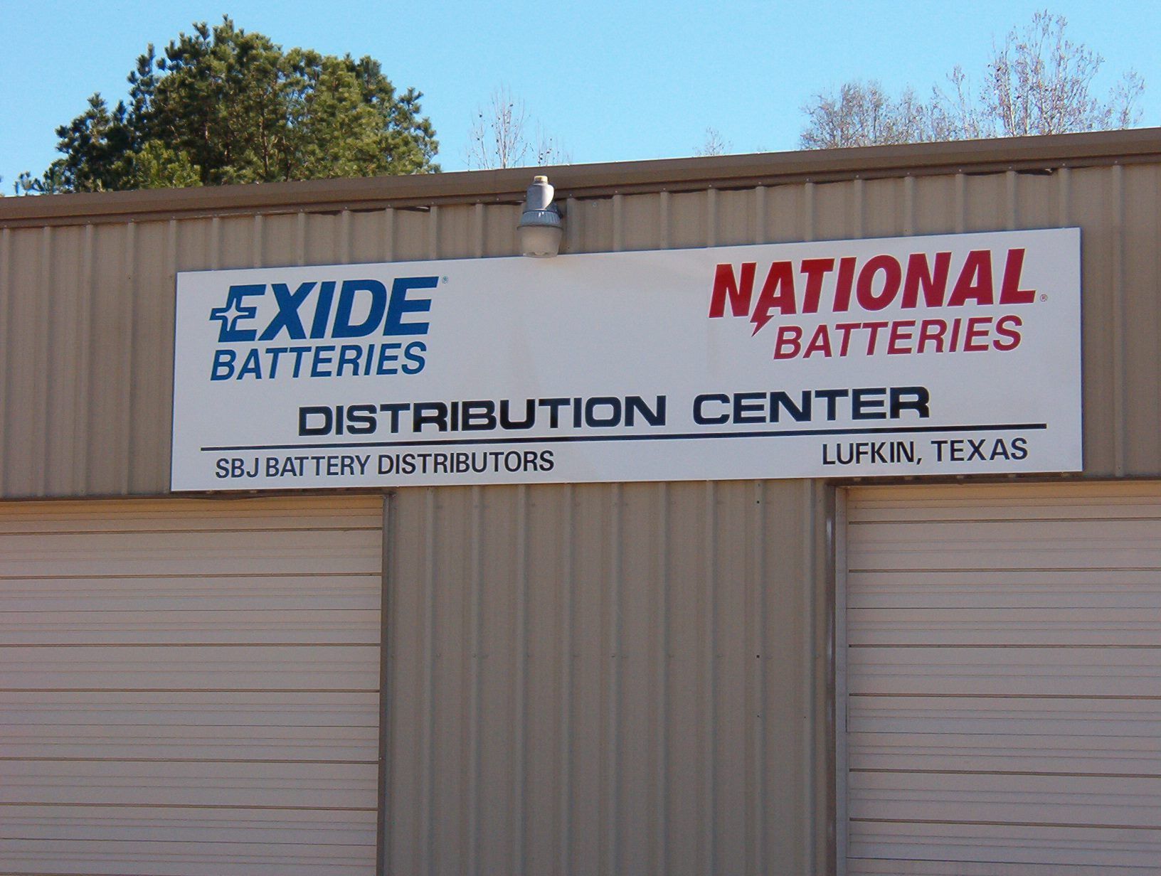 Sign for Exide and National Batteries Distribution Center in Lufkin, Texas.