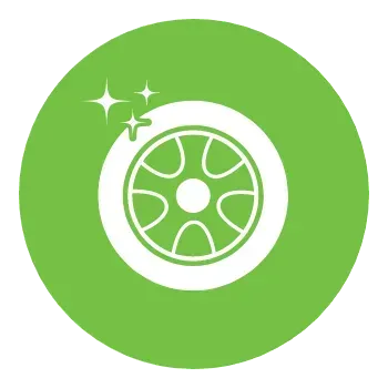 A white tire in a green circle on a white background.