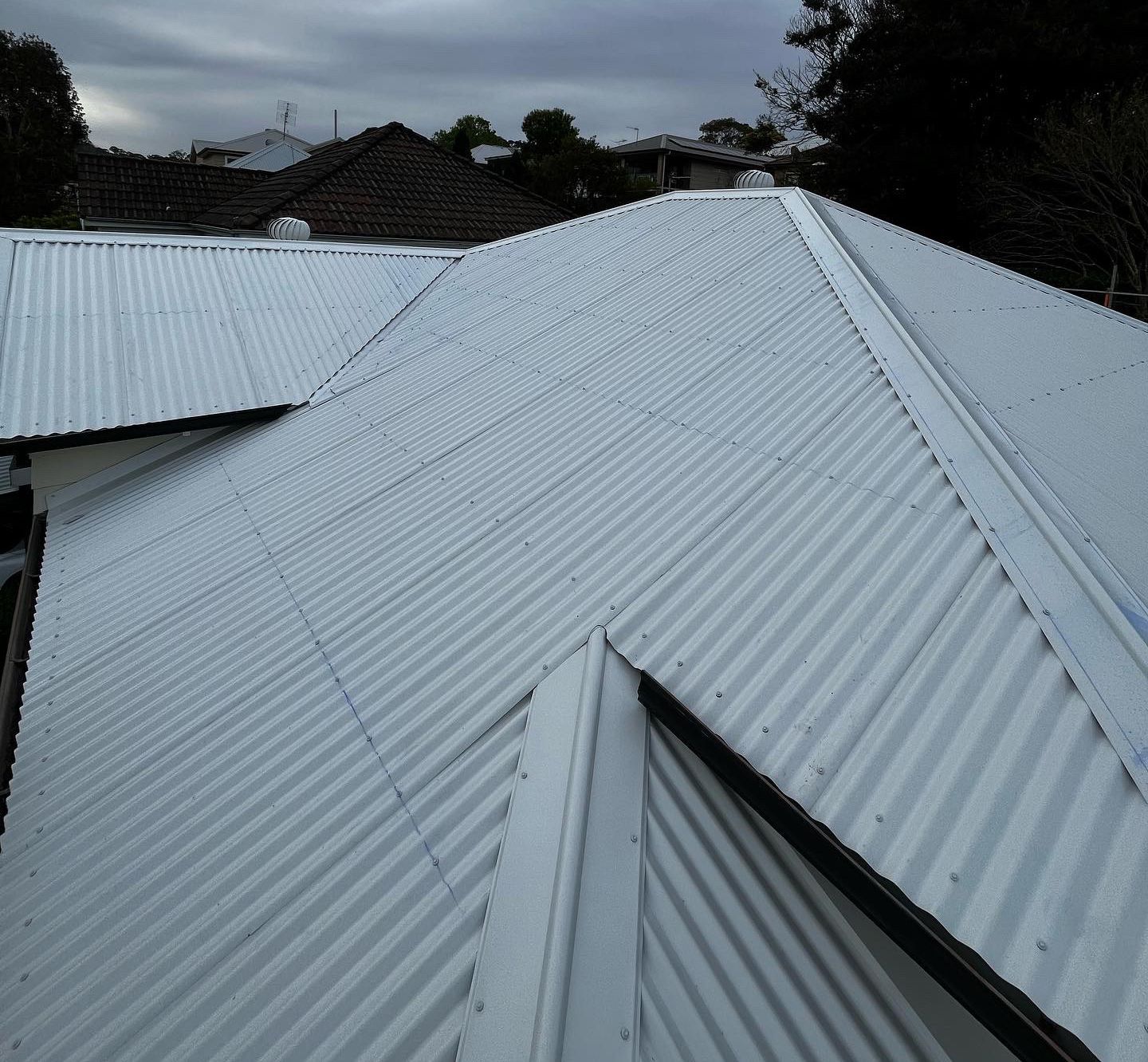 Gray Corrugated Metal Roof on a House — Roofing in Newcastle, NSW