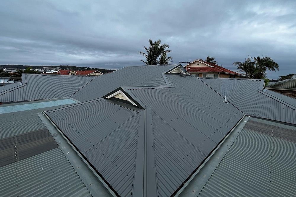 Gray Corrugated Metal Roof on a House — Roofing in Newcastle, NSW