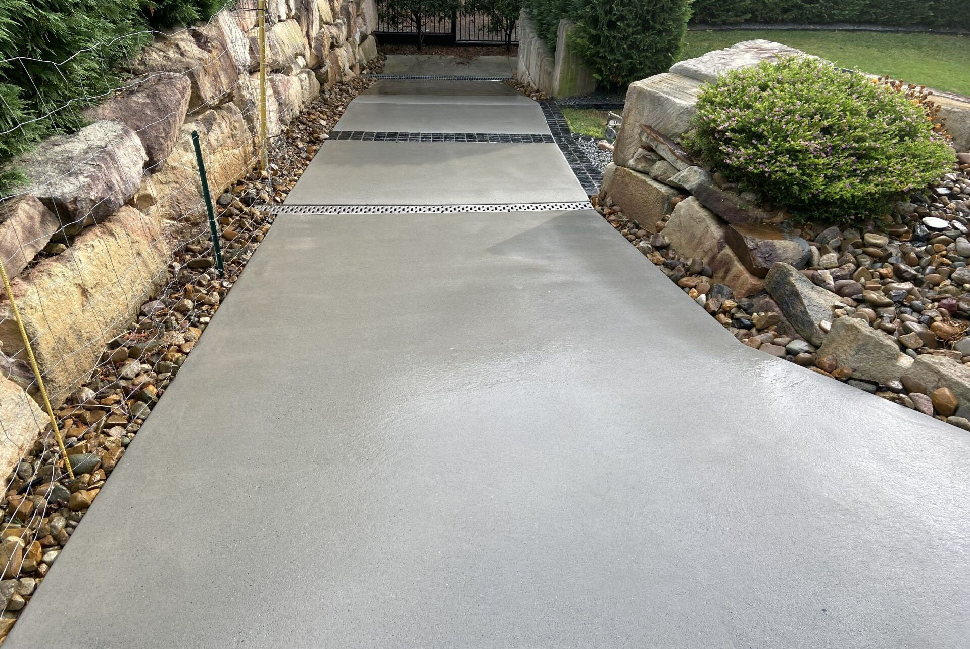 an image of a clean driveway after a great job by our pressure cleaning business