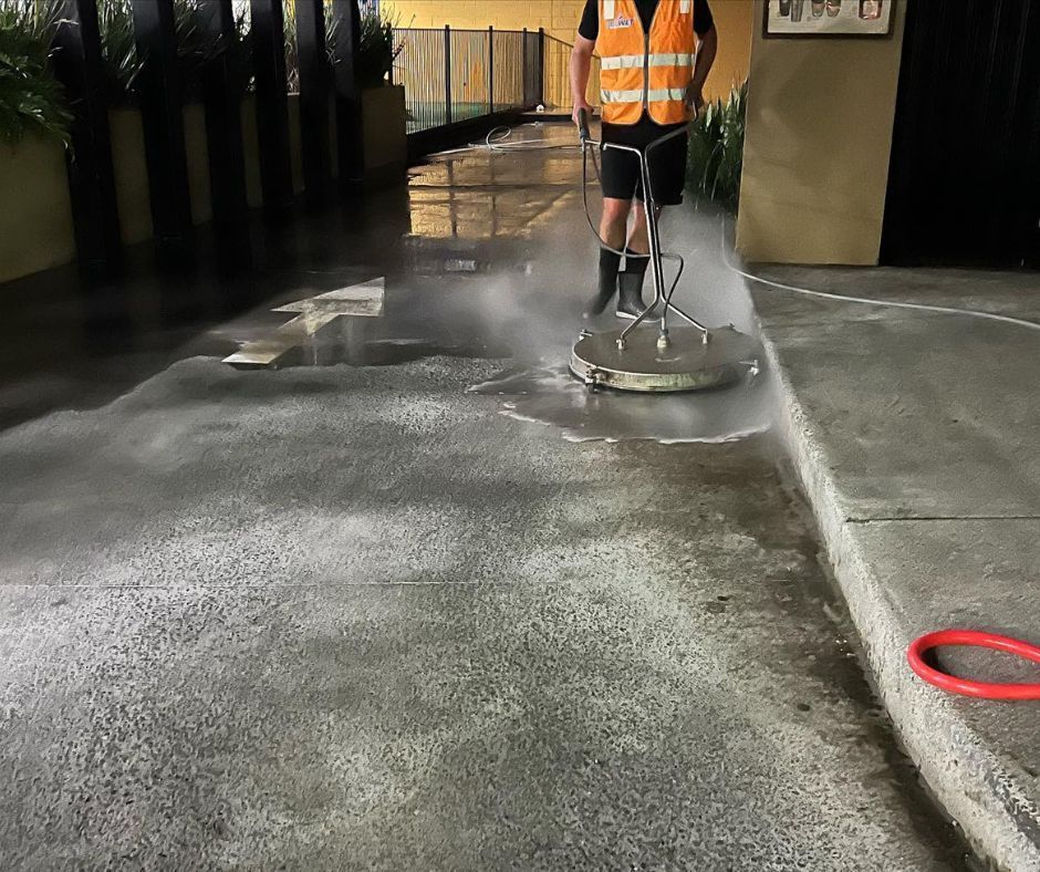 Power washing an exterior concrete surface