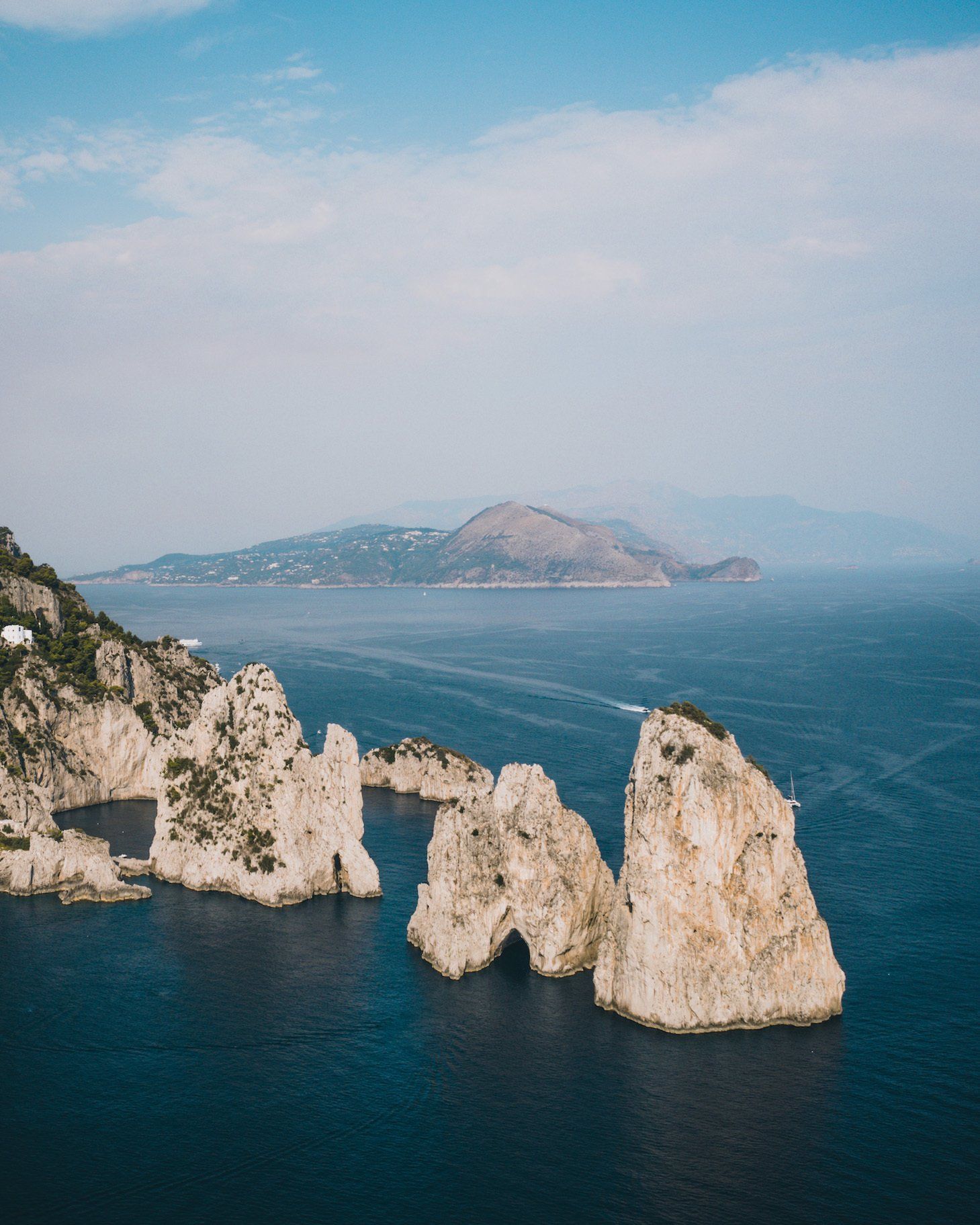Faraglioni rocks in Capri, luxury yachts in capri