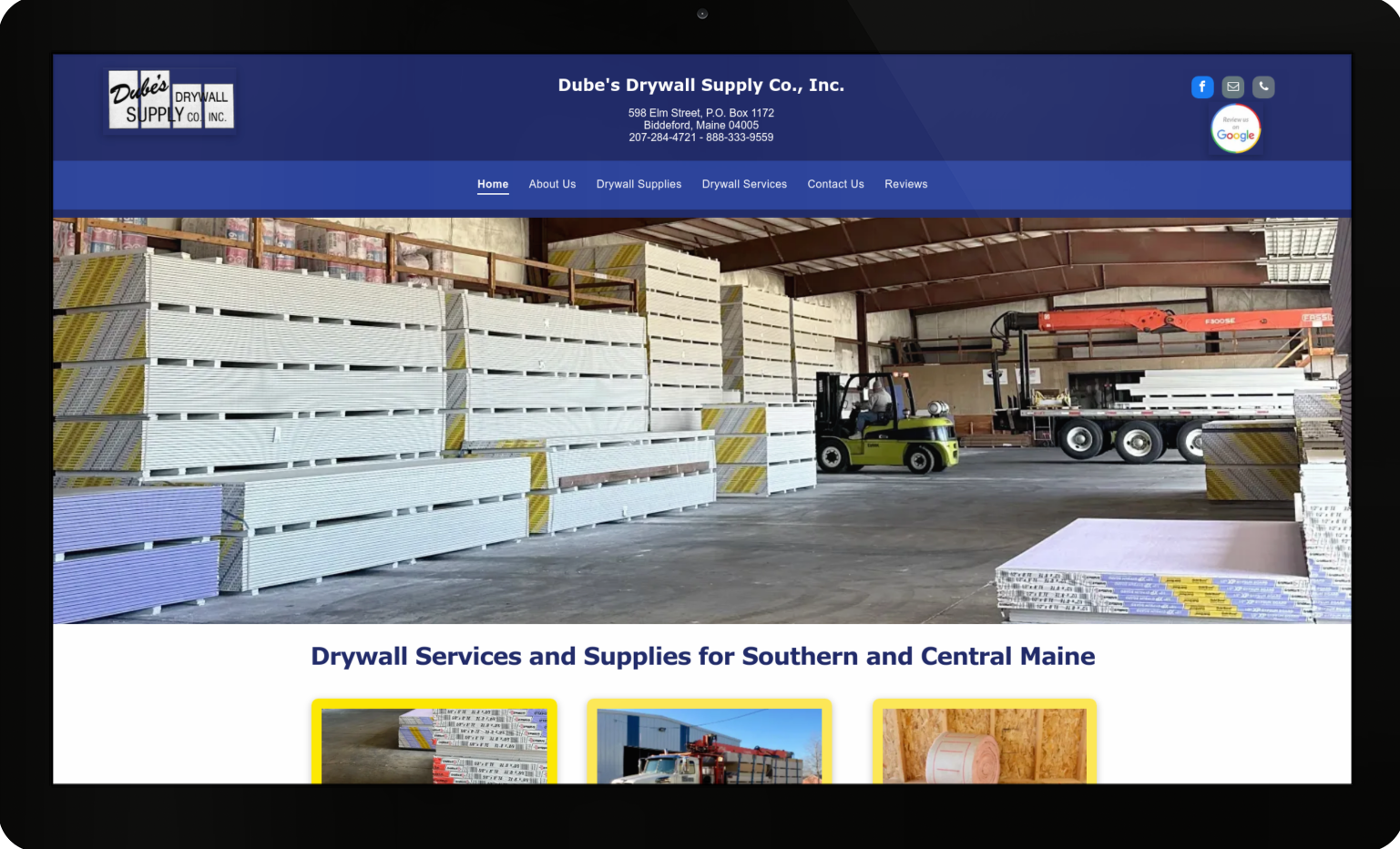 A computer screen shows a picture of a building under construction