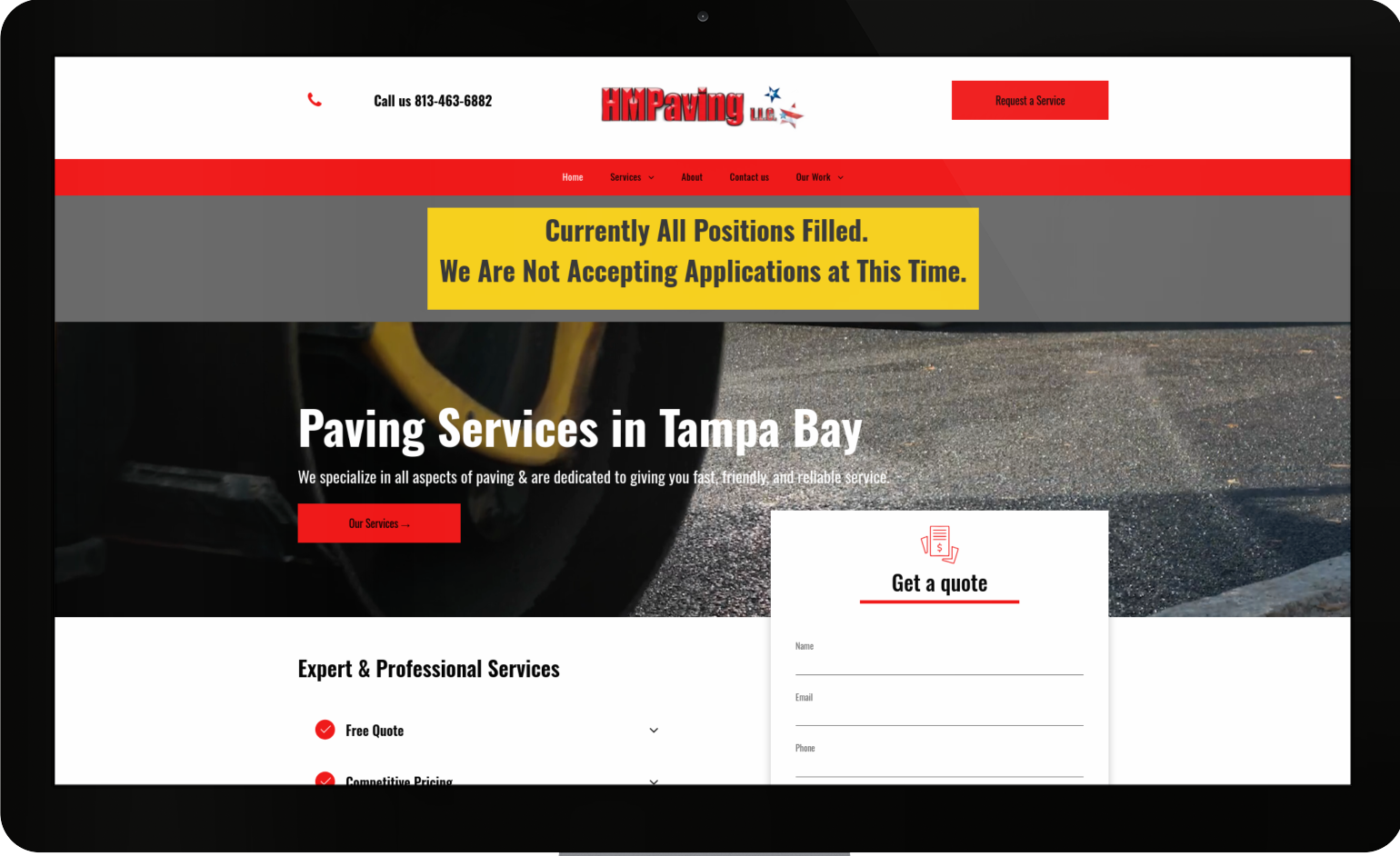 A computer screen shows a website for paving services in tampa bay