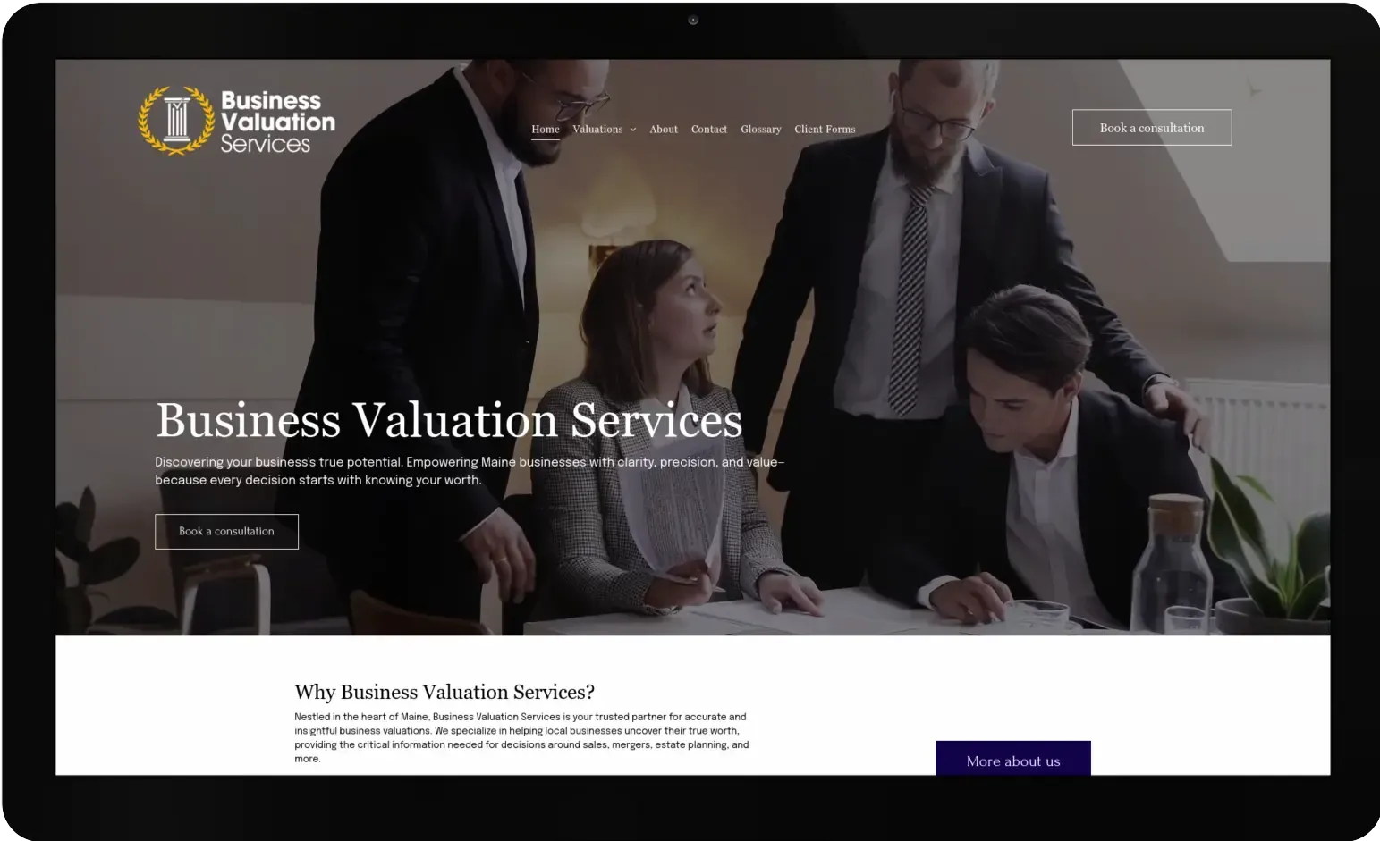 A tablet with a business valuation services website on it.