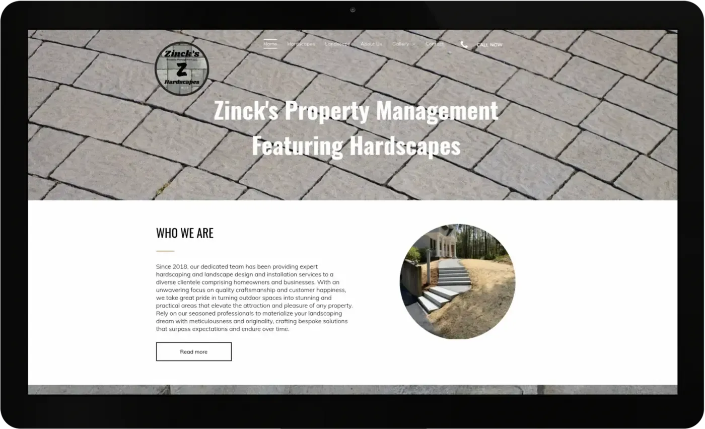 A computer screen shows a website for zinck 's property management featuring hardscapes
