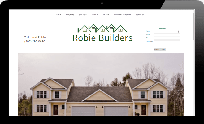 A computer screen shows a website for robie builders