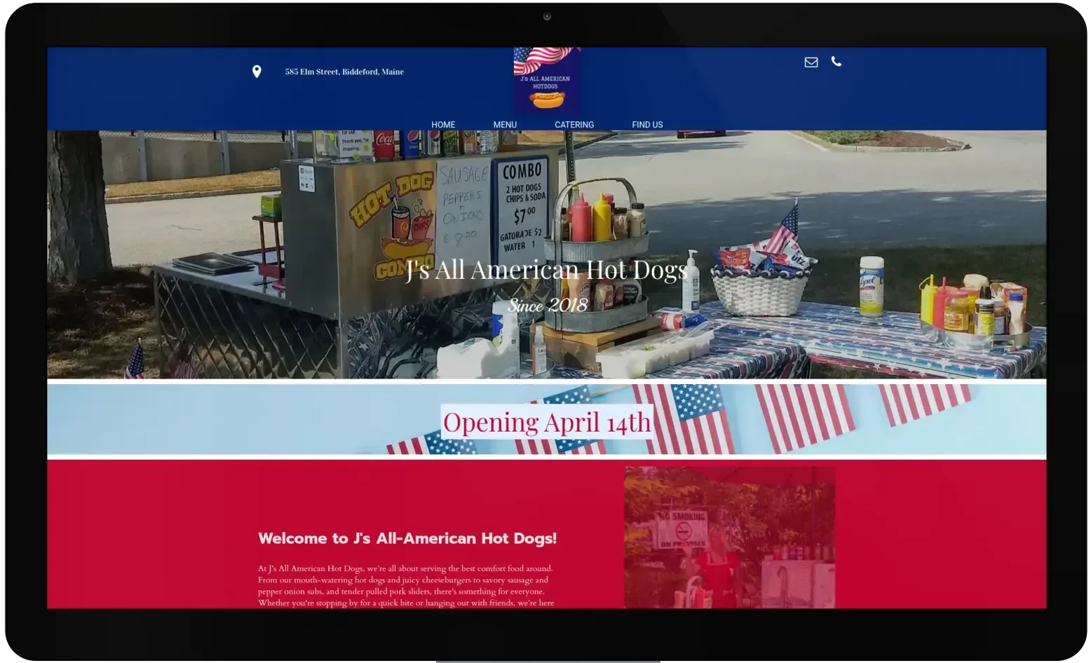 A computer screen shows a website for an american hot dog stand.