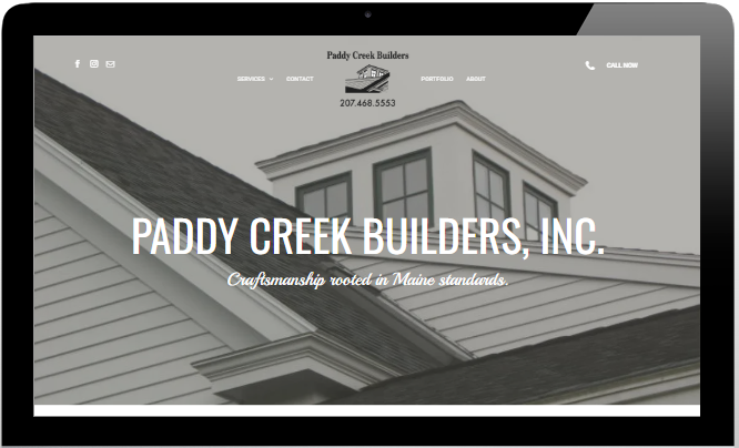Website homepage for Paddy Creek Builders, Inc. with gray roof background and white text/logo
