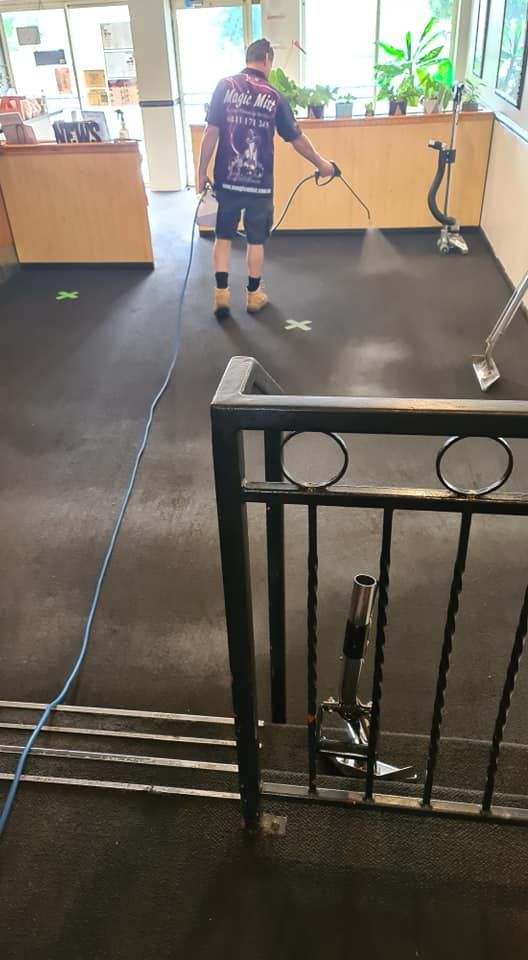 Red Rectangular Rug With Floral Pattern and Cream Border — Magic Mist Carpet Cleaning in Rockhampton City, QLD