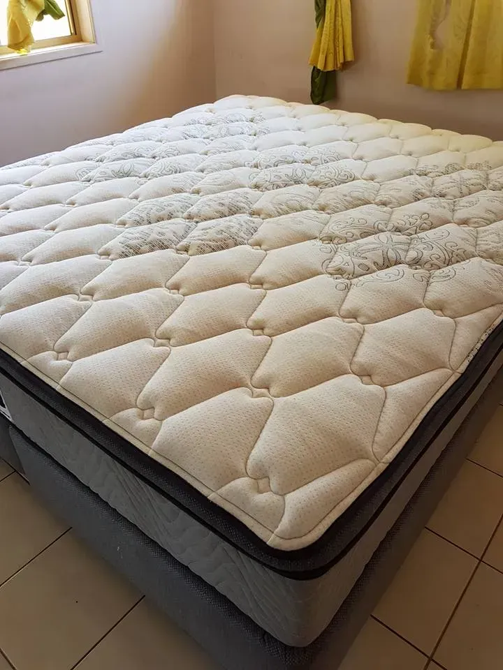 Man Cleaning a Gray Couch — Magic Mist Carpet Cleaning in Rockhampton City, QLD