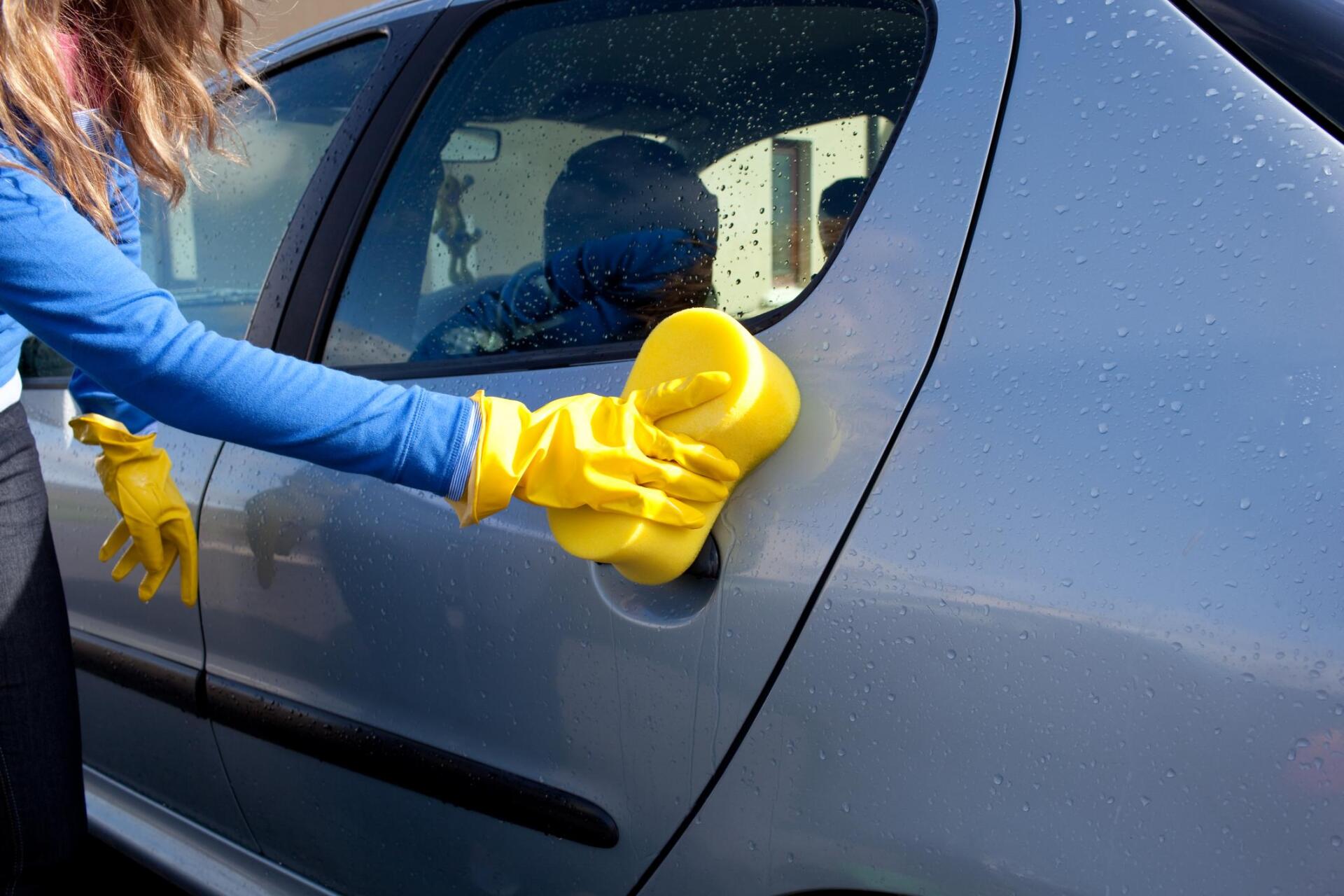 woman cleaning the car