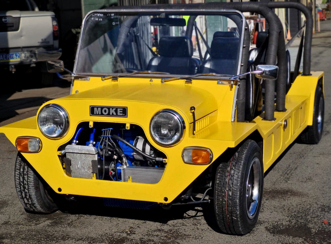 A Yellow Vehicle With the Word Moke on the Front — BJM Mechanical Mufflers & Tyres In Oxenford, QLD