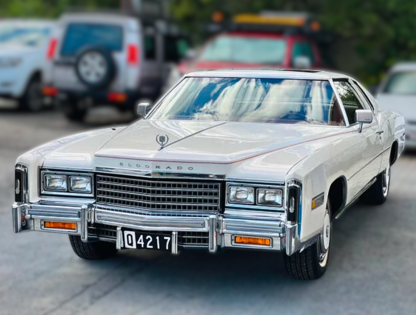 A White Car With a License Plate That Says 04217 — BJM Mechanical Mufflers & Tyres In Oxenford, QLD