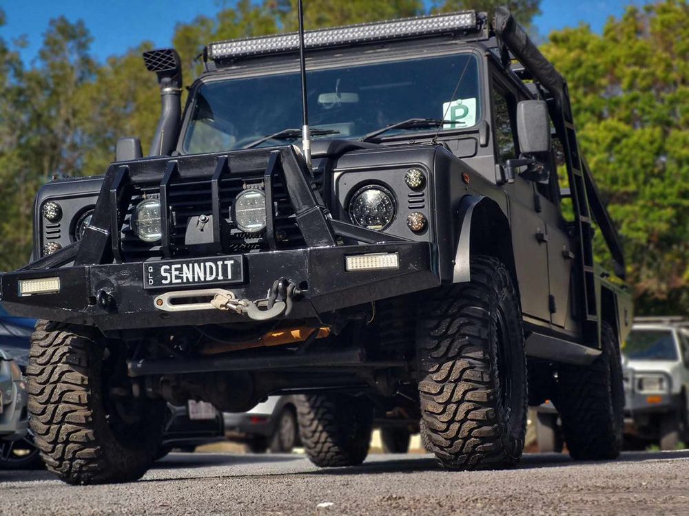 Black, Rugged Off-Road Vehicle With Large Tires And A Light Bar — BJM Mechanical Mufflers & Tyres On The Gold Coast, QLD