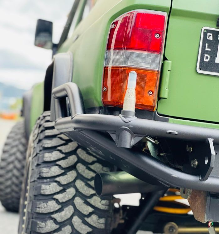 A Green Truck With a License Plate That Says Lp — BJM Mechanical Mufflers & Tyres In Oxenford, QLD