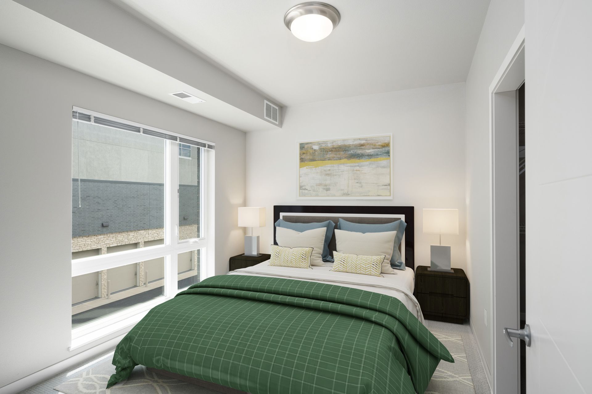 Bedroom with a bed, nightstands, window, and artwork. Green comforter, white walls.