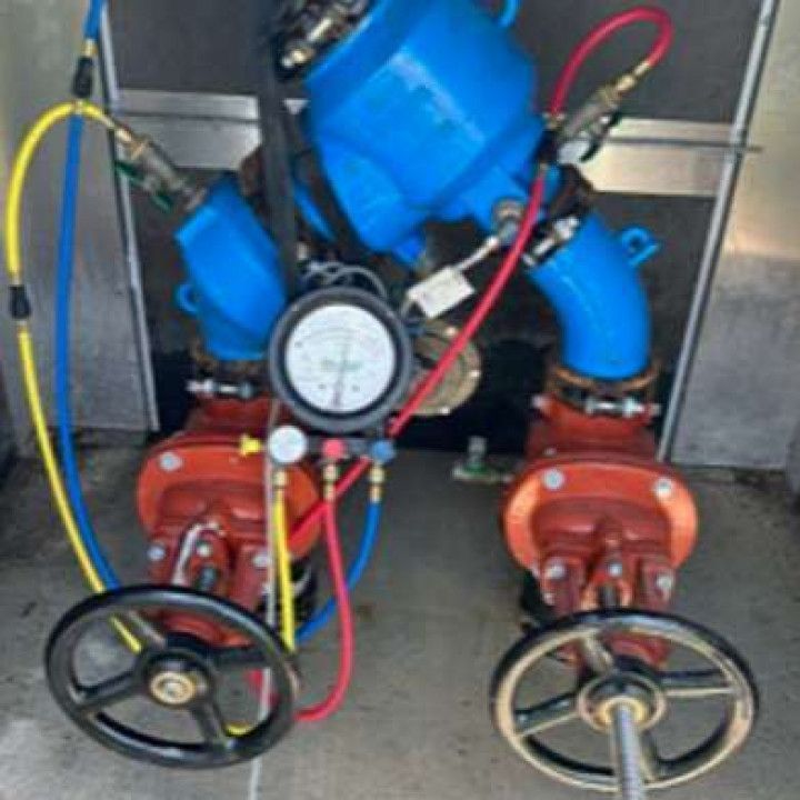 A pair of valves with gauges attached to them