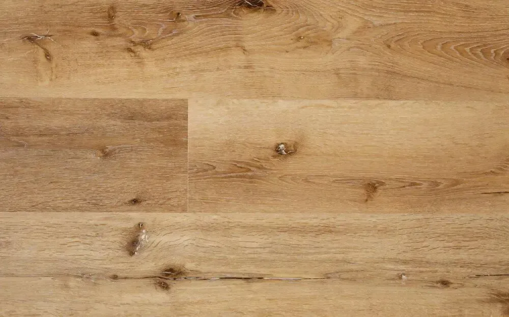 Light brown wood-look flooring with natural grain, knots, and varying shades.