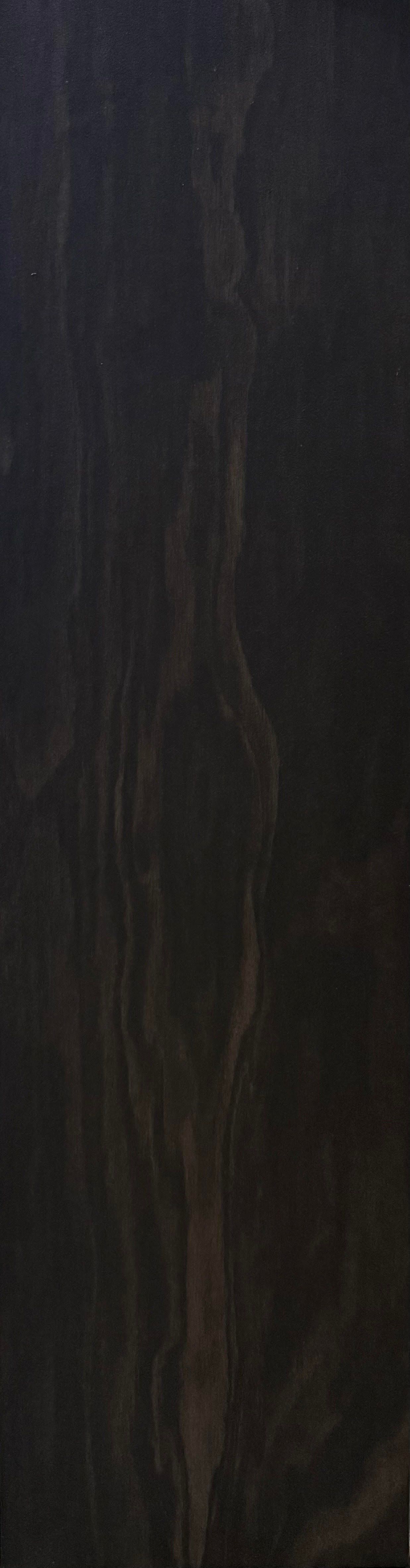 Dark wooden surface with visible grain and texture.