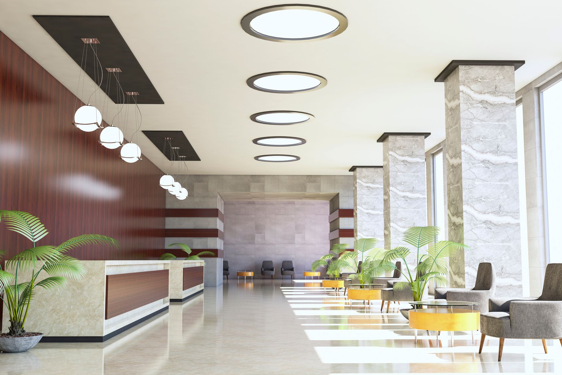 A large lobby with a reception desk and chairs.